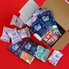 Merry Making Gift box flat lay - Theo holiday gift box filled with chocolate treats