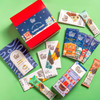 Holiday Magic gift box with contents laying flat on green background
